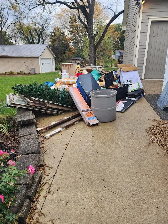 Dumpster being loaded with debris for Residential Dumpster Rental in Hazlet